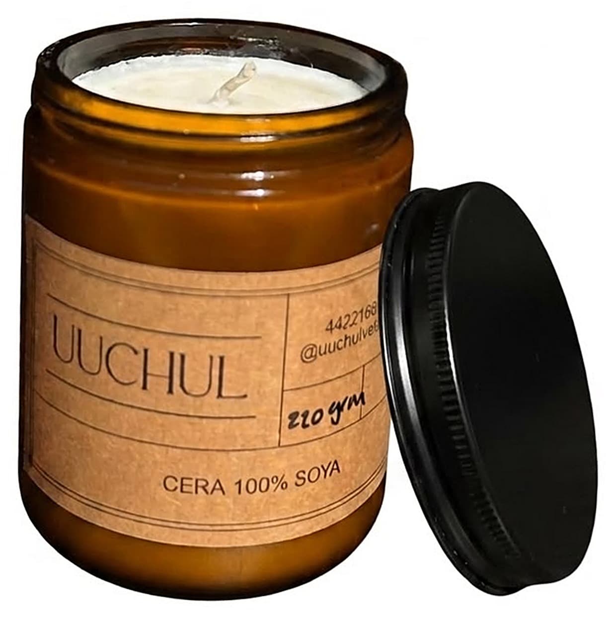 Vela UUCHUL de cera de soya en frasco de vidrio ámbar, encendida